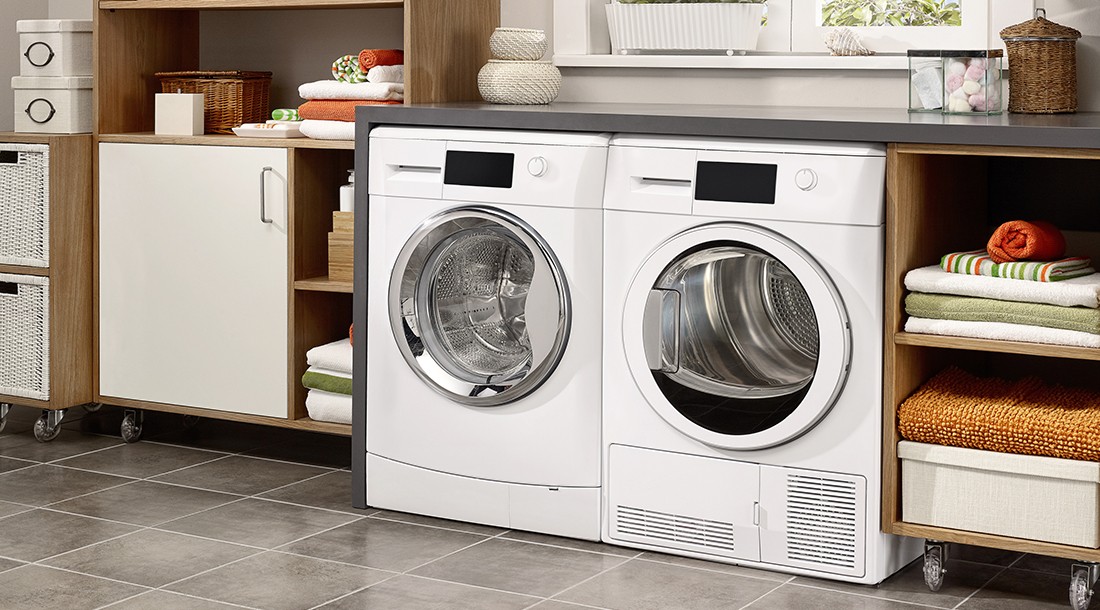 Domestic laundry room with washing machine and dryer